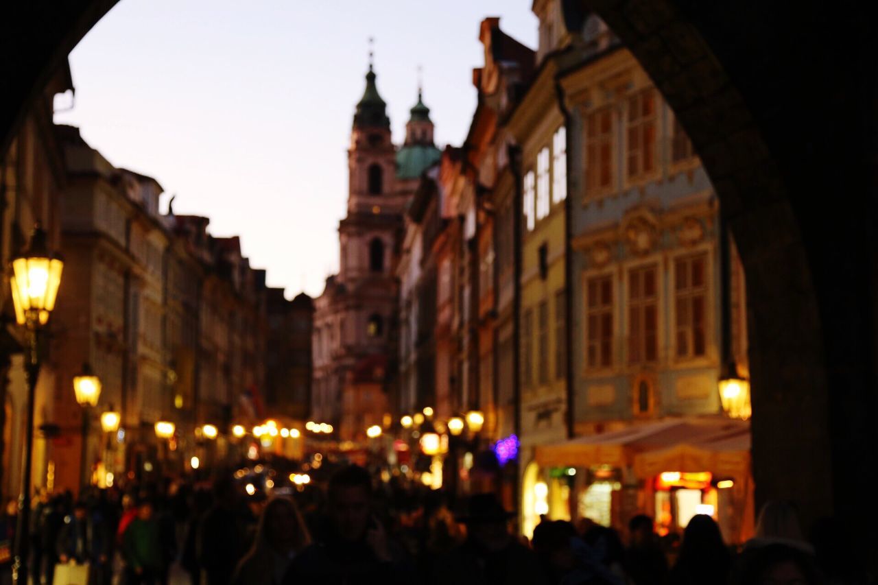 architecture, building exterior, large group of people, built structure, illuminated, religion, place of worship, spirituality, night, church, famous place, travel destinations, tourism, history, person, crowd, men