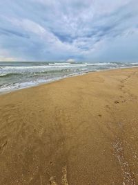 Scenic view of beach against sky