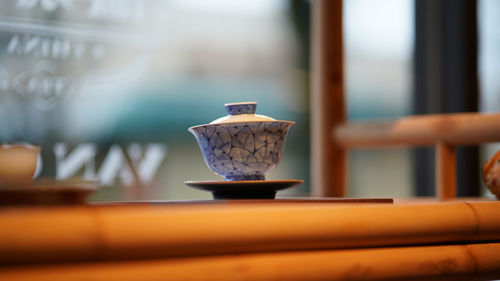 Close-up of coffee cup on table