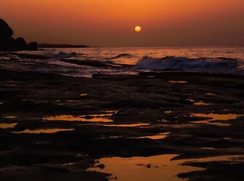 Scenic view of sea at sunset