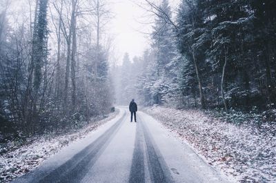 Woman walking on road