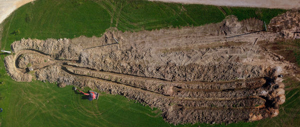 High angle view of man relaxing on field