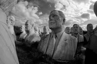 Low angle view of statues against sky