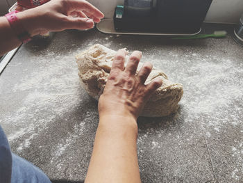 Kneading dough on a kitchen worktop