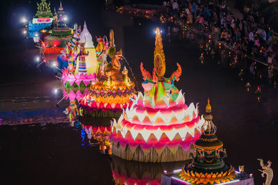 Illuminated lanterns outside building at night