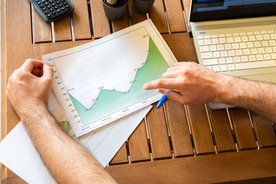 High angle view of man working on table