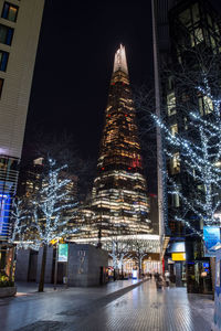 Illuminated city buildings at night