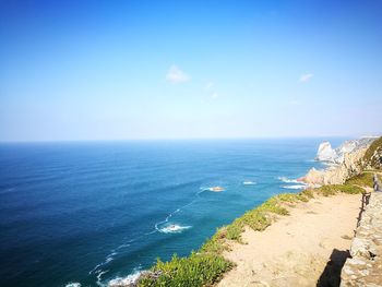 Scenic view of sea against blue sky