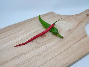 Close-up of red chili peppers on table