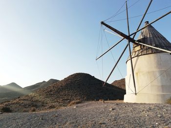 Low angle view of wind turbine against clear sky in almeria, cabo de gata, andalucia