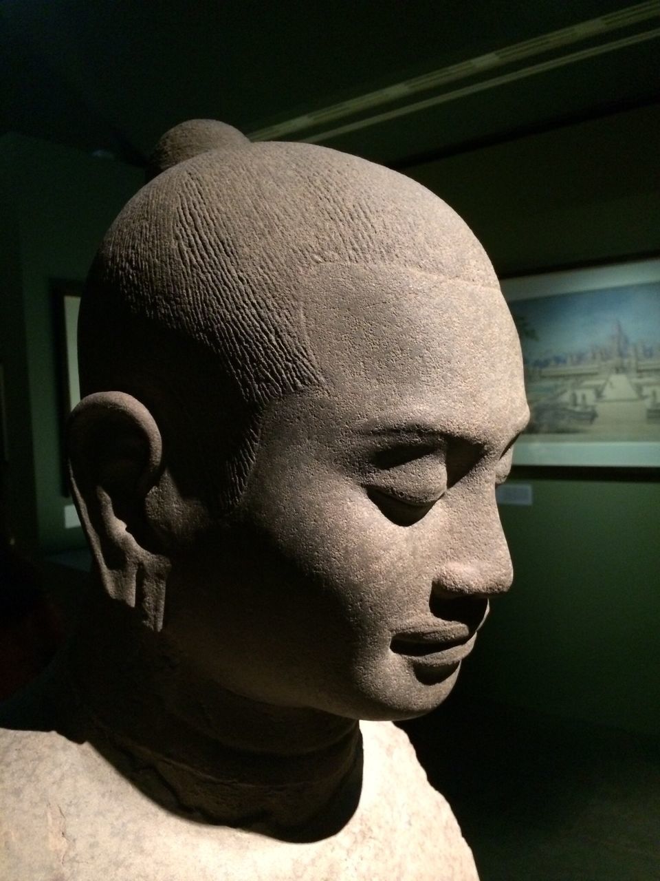 indoors, human representation, close-up, art and craft, statue, creativity, art, sculpture, holding, person, front view, home interior, low angle view, wall - building feature, focus on foreground, lifestyles