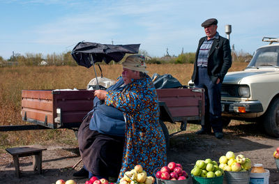 People with fruits at farm