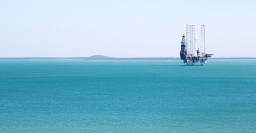 Ship in sea against clear sky