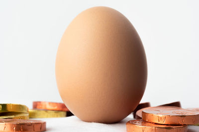 Close-up of eggs against white background