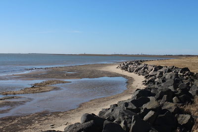 Scenic view of beach against sky