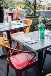 Outdoor dining patio tables with colorful metal chairs