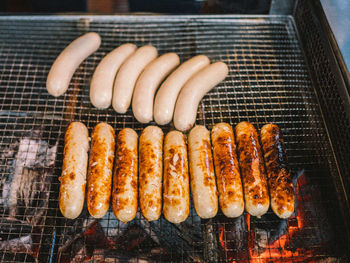 Close-up of sausages on barbecue grill