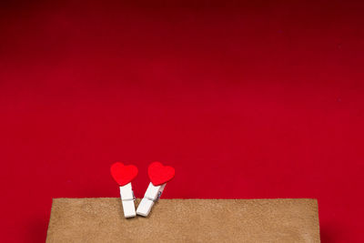 Close-up of wood against red background