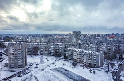 High angle view of buildings in city against sky