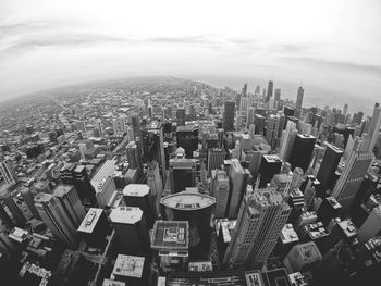 High angle view of modern buildings in city against sky