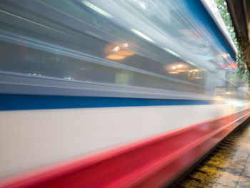 Blurred motion of train at railroad station