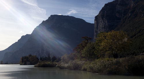 Scenic view of lake and mountains against sky