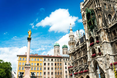 Low angle view of virgin mary statue on column at marienplatz