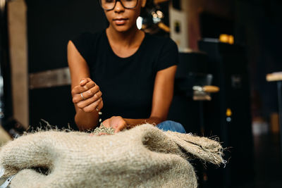 Young woman working in workshop