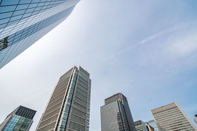 Low angle view of modern buildings against sky in city