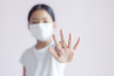 Portrait of human hand against white background