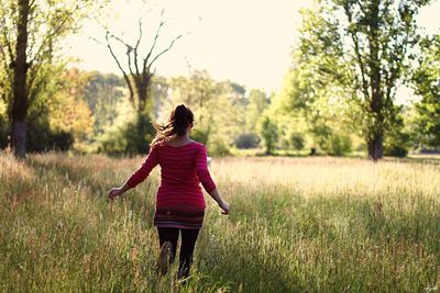 Woman running on field