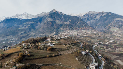 High angle view of mountain range against cloudy sky