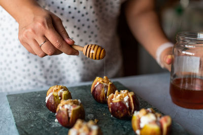 Midsection of man preparing food on table