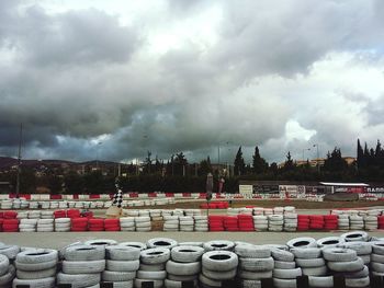 View of stack of row against cloudy sky