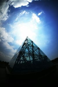 Low angle view of building against cloudy sky