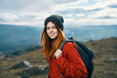 Young woman standing in park during winter