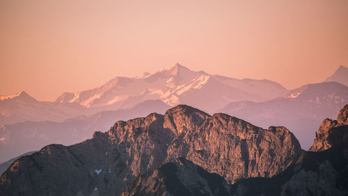 Scenic view of mountains against sky during sunset