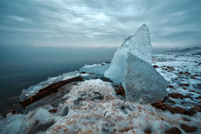 Scenic view of sea against sky during winter