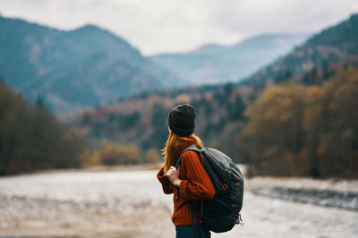 Rear view of man looking at mountain