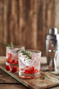 Close-up of drinks on wooden table