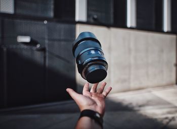 Juggling the lens in front of the modern building