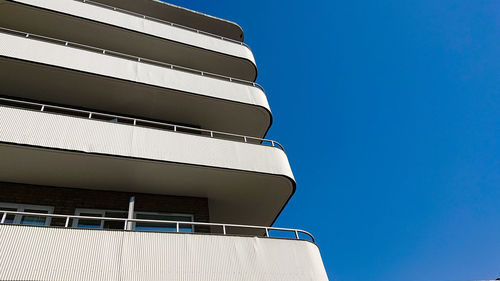 Low angle view of building against clear blue sky