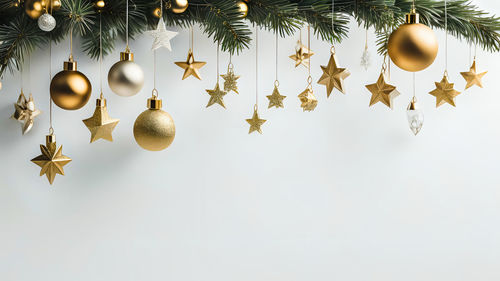 Close-up of christmas decorations against white background