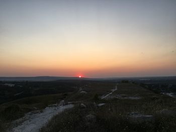 Scenic view of landscape against sky during sunset