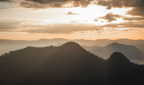 Scenic view of mountains against sky during sunset