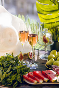 Close-up of wine glasses on table