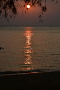 Scenic view of sea against romantic sky at sunset