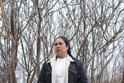 Portrait of teenage girl standing in snow