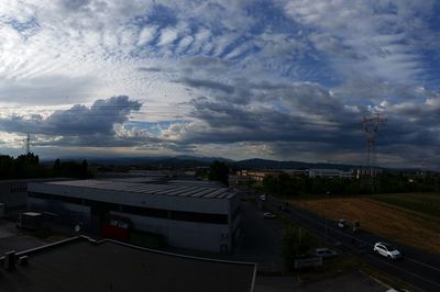 View of city against cloudy sky