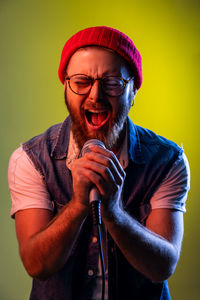 Man shouting while performing on mic